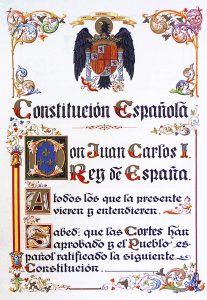 Constitucion de 1978 con su escudo original ahora acusado de inconstitucional: España Orwelliana